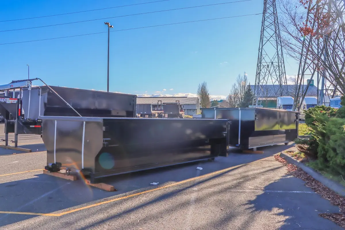 Roll-off dumpster ready for waste disposal at job site for Concrete Dumpster Rental in Blackman